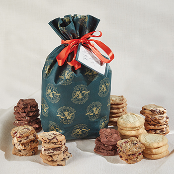 Elevate the season with Carolina Cookie's exquisite winter gift - a green cookie bag with gold patterns, perfect for holidays, weddings, and special celebrations. Share the delight with online ordering!